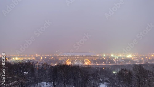 Day to Night Transition Timelapse: Panoramic View of Moscow City, Russia, from Sparrow Hills. Aerial view to stadium after sunset