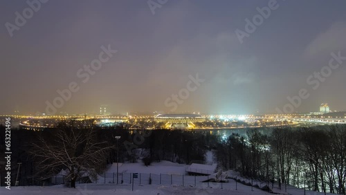 Day to Night Transition Timelapse: Panoramic View of Moscow City, Russia, from Sparrow Hills. Aerial view to illuminated stadium
