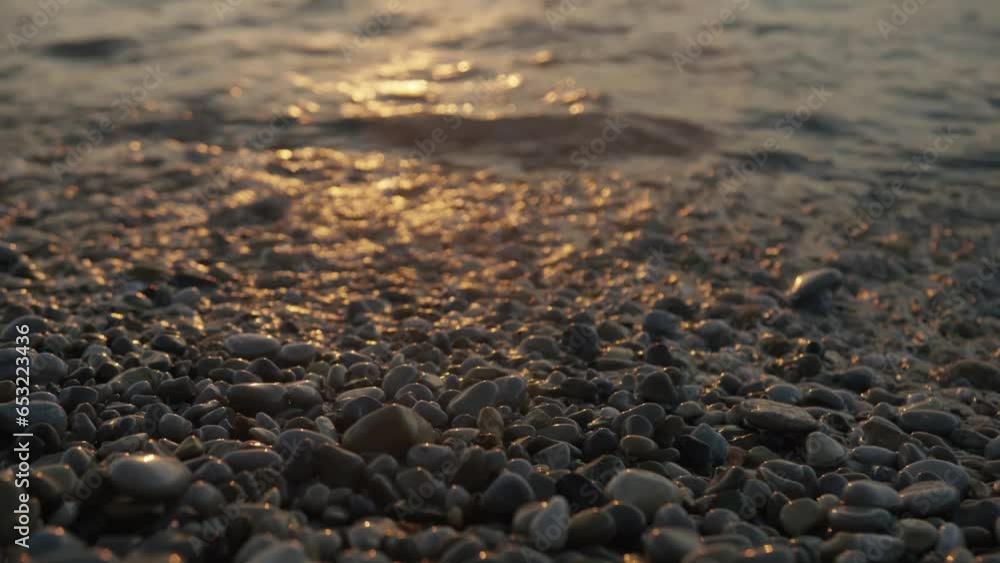 Close up of tide coming in on rocky beach Close up of tide coming in on rocky beach