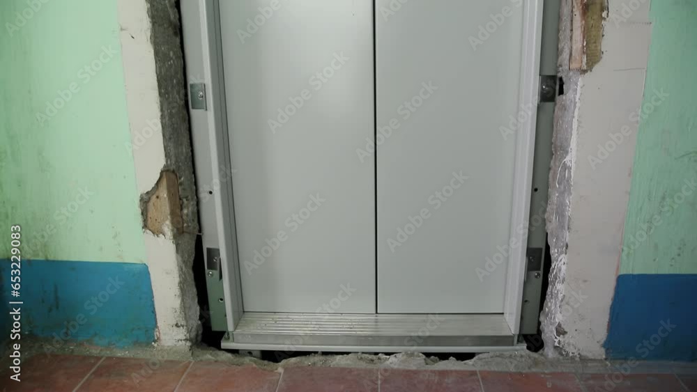 The doors of the new elevator on the staircase. Replacing an old elevator with a new one at the end of its service life, industry The doors of the new elevator on the staircase. Replacing an old elevator with a new one at the end of its service life, industry