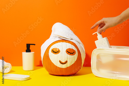 Fotografie, Tablou Pumpkin with face mask and skin care products
