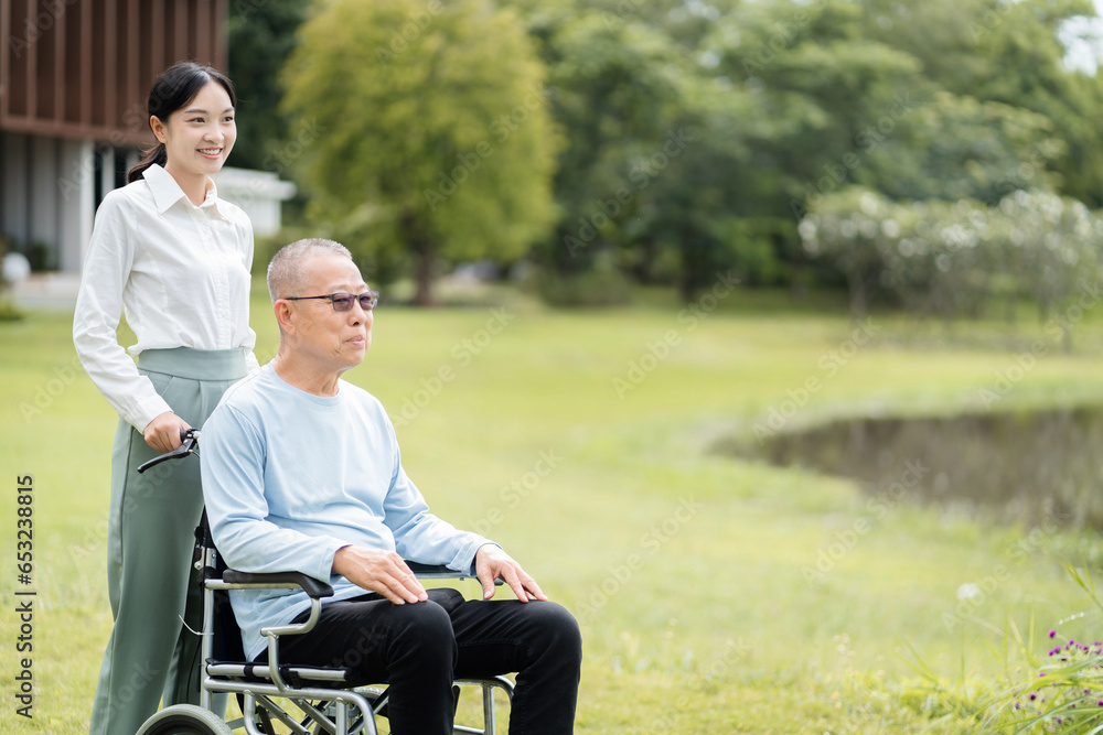 Helpful volunteers caring for elderly men at home health care. Helpful volunteers caring for elderly men at home health care.