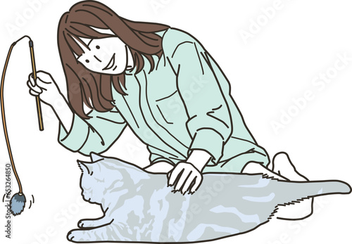 猫と遊ぶ私服姿の若いアジア人の女性