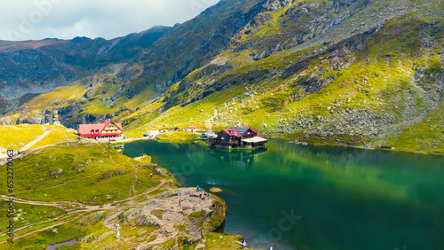 Aerial top down view Balea mountain lake. Romania Transfagarash. Shot on drone. Famous tourism travel destination