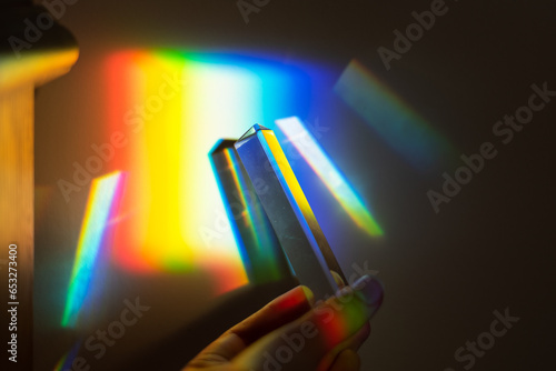 hand holding a prism rainbow effect on a wall colorful light science  © ms16_photo