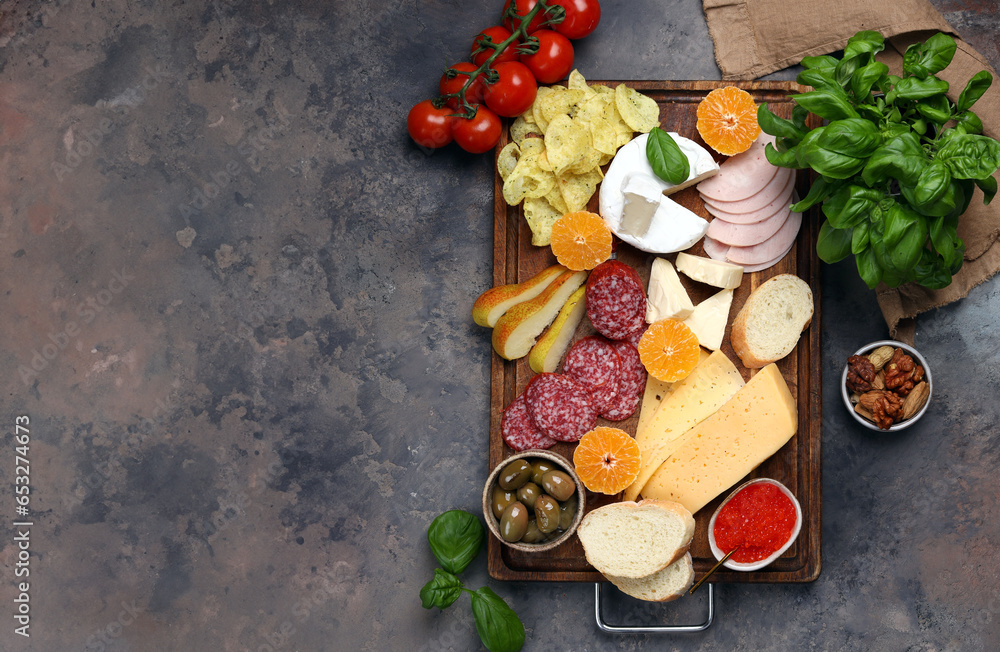 snack plate with cheese, ham, salami and crackers snack plate with cheese, ham, salami and crackers