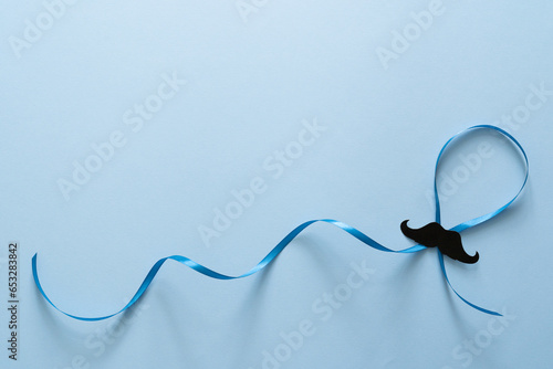 Movember concept - event to raise awareness of men's health issues, moustache anf blue ribbon photo