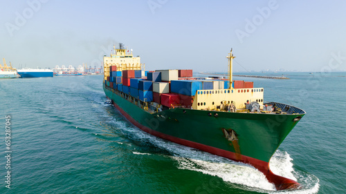 cargo container ship carrying in sea import export goods and distributing products to dealer consumers across Asia pacific and worldwide global business transportation by container ship open sea