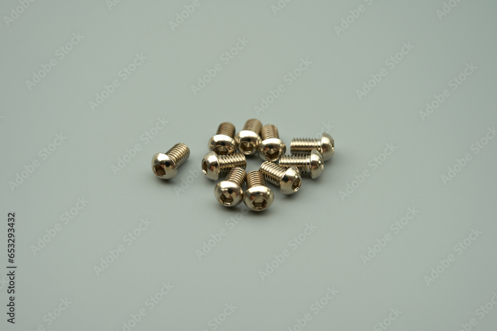 Stainless steel flat head hex bolt, gray background Stainless steel flat head hex bolt, gray background