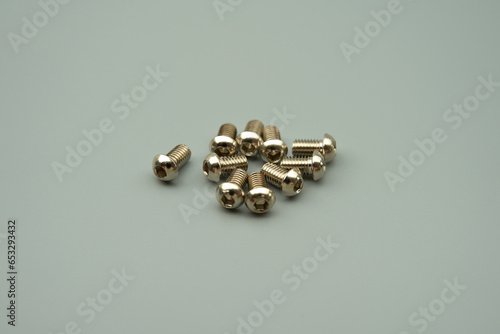 Stainless steel flat head hex bolt, gray background