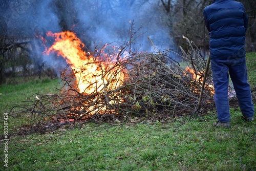 Burning of waste branch in the garden autumn tradition