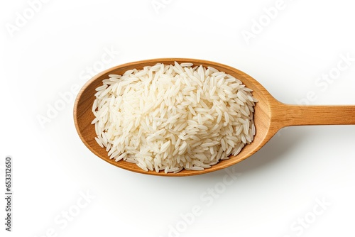 close up of rice in a wooden spoon isolated on white