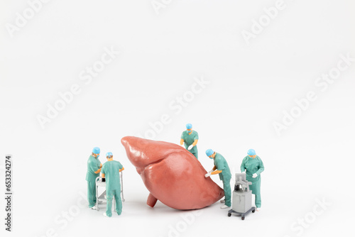 Miniature people, Doctor and nurse medical team are performing surgical operation at emergency room