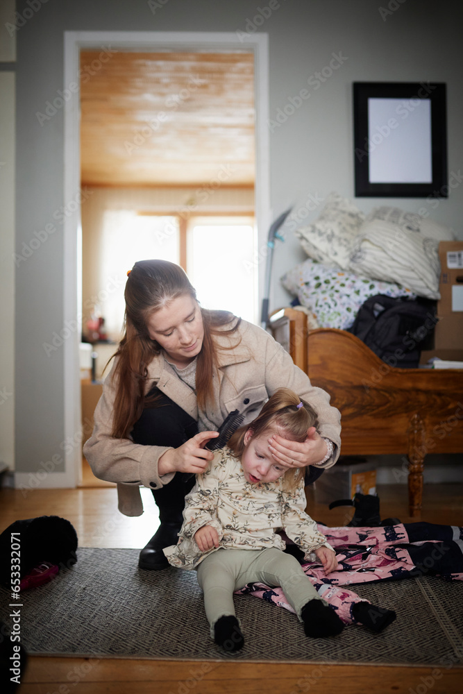 Mother taking care of disabled child at home Mother taking care of disabled child at home