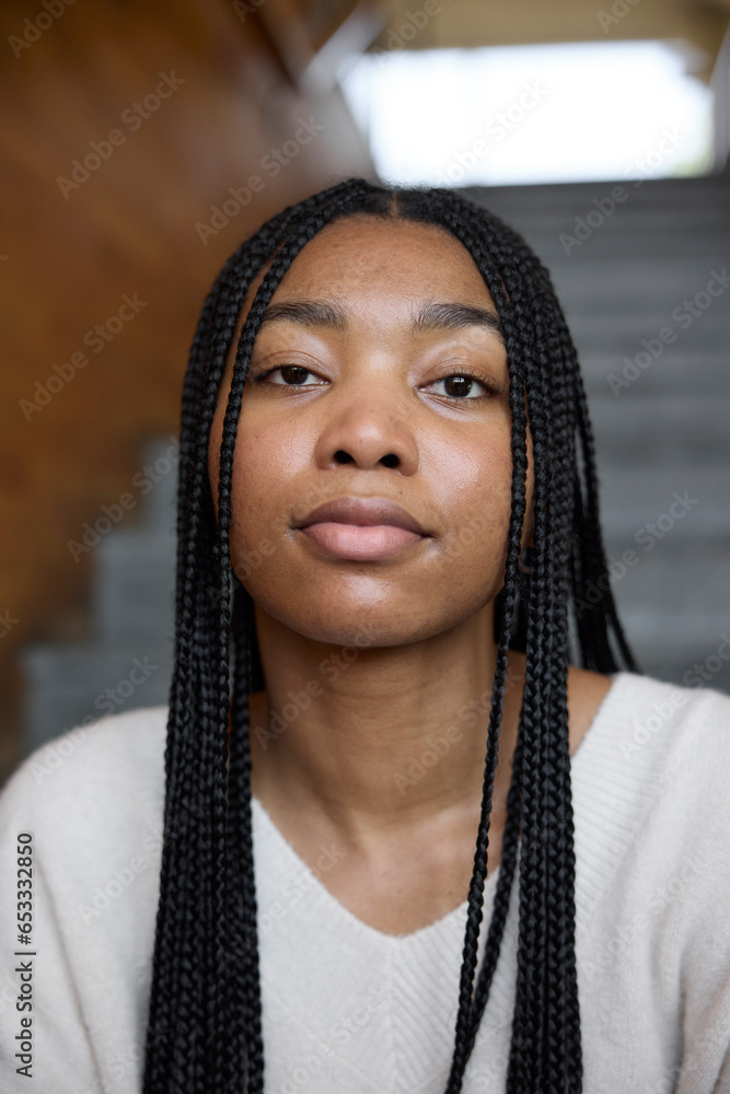 Portrait of confident young woman with braided hair Portrait of confident young woman with braided hair
