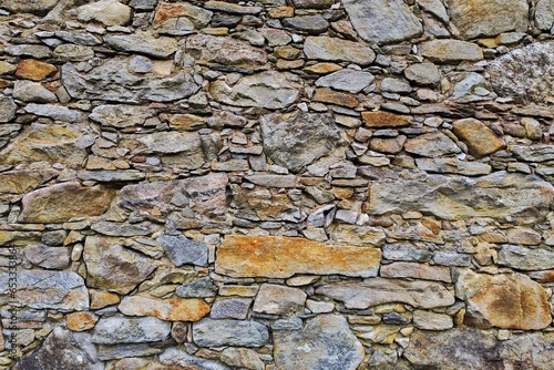 Stone wall on an old cottage, old wall