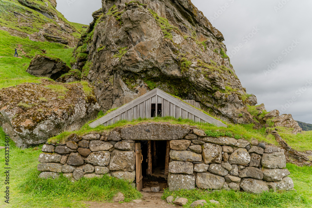 Viking house. Picturesque landscape among the mountains of Iceland. Viking house. Picturesque landscape among the mountains of Iceland.