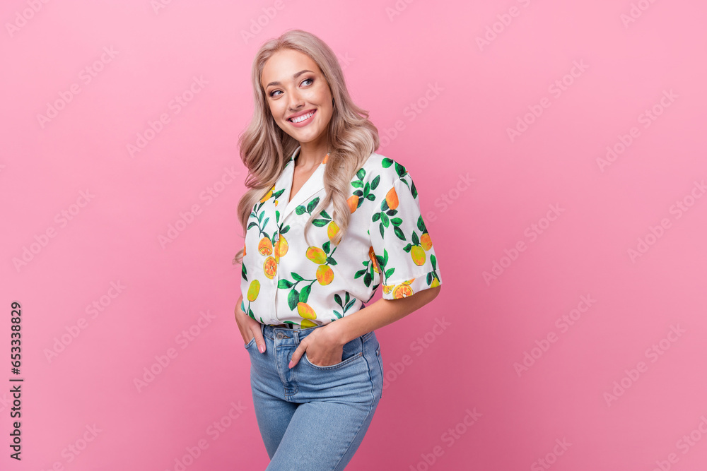 Portrait of lovely gorgeous woman with curly hairdo wear stylish shirt look at discount empty space isolated on pink color background Portrait of lovely gorgeous woman with curly hairdo wear stylish shirt look at discount empty space isolated on pink color background