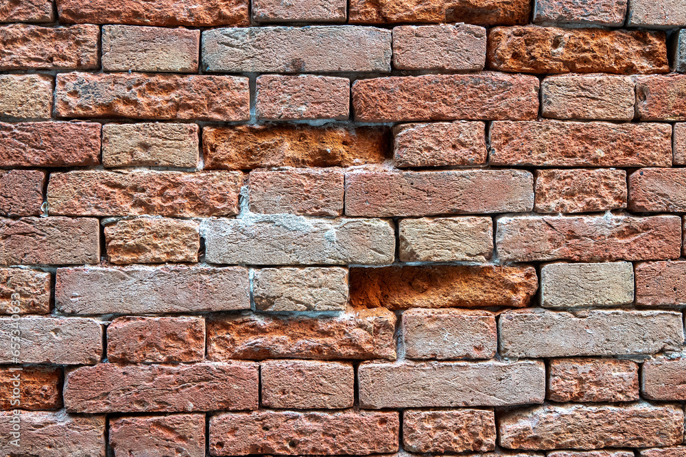 Venetian building weathered old red brick surface detail, rustic texture horizontal design background or wallpaper and copy space. Venetian building weathered old red brick surface detail, rustic texture horizontal design background or wallpaper and copy space.