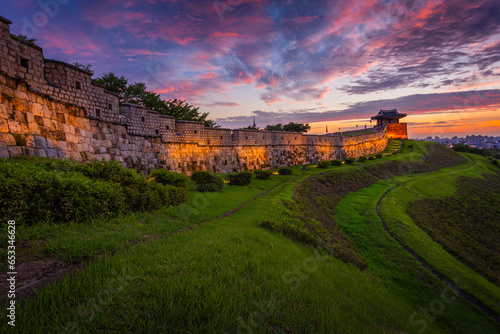 Old city wall at Hwaseong Fortress after Sunset, Traditional Architecture of Korea at Suwon, South Korea.