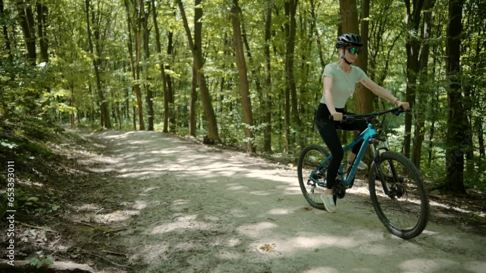 Girl wearing helmet cycling on bike for sport recreation Girl wearing helmet cycling on bike for sport recreation