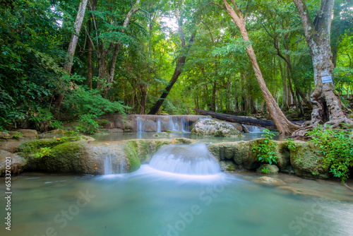 Nature beautiful deep forest waterfall. © Jutatip