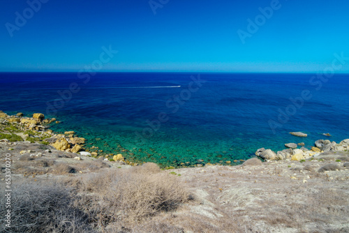 A hiking trail in the direction of Ramla Bay: .Ramla Bay is a sea bay with a sandy beach in the north of the island of Gozo in the Maltese archipelago.