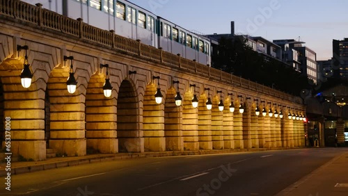 The Bercy bridge in the evening with a metro that runs on it. Paris, France - September 15th, 2023:  