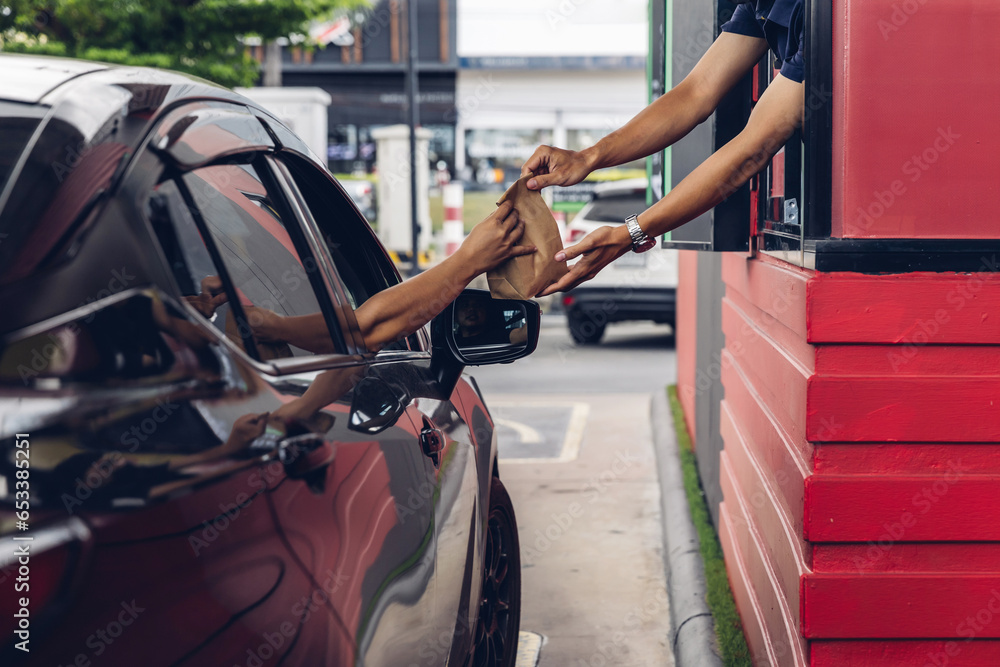 custom made wallpaper toronto digitalHand Man in car receiving coffee in drive thru fast food restaurant. Staff serving takeaway order for driver in delivery window. Drive through and takeaway for buy fast food for protect covid19.