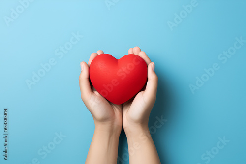 hands holding red heart, health care, love, organ donation, mindfulness, wellbeing, family insurance and CSR concept, world heart day, world health day, world mental health day, praying concept
