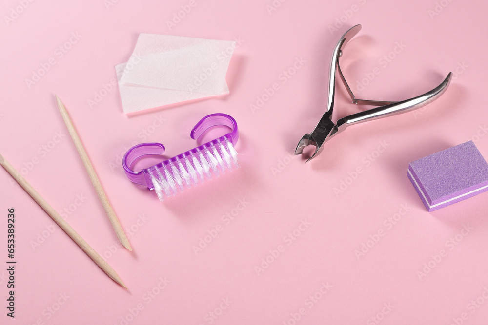 Professional manicure set on a pink background. The concept of hand care, salon procedures. Professional manicure set on a pink background. The concept of hand care, salon procedures.