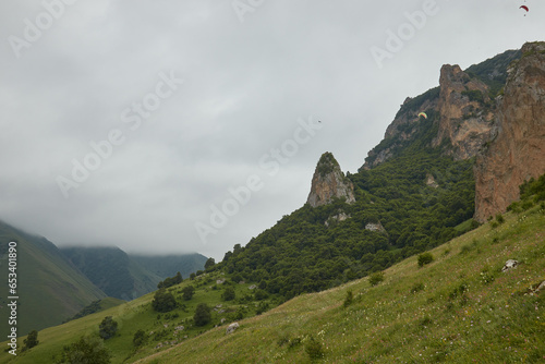 mountains in fog, rocks, green grass, mountain landscape