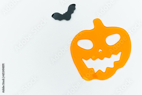Halloween or Samain pumpkin and bat on a light background

 photo