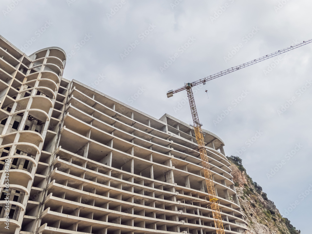 Massive concrete house taking shape, a work in progress. Construction site showcases modern design and sturdy architecture Massive concrete house taking shape, a work in progress. Construction site showcases modern design and sturdy architecture