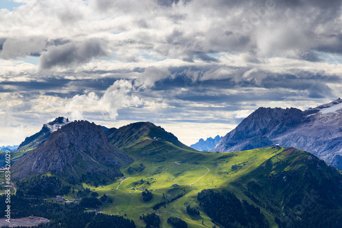 Fototapeta Naklejka Na Ścianę i Meble -  A view of the Dolomites and the countryside into Val di Fassa