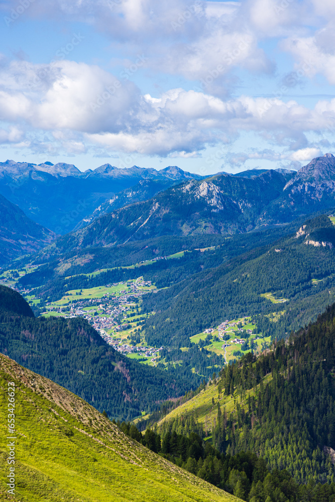 A view of the Dolomites and the countryside into Val di Fassa A view of the Dolomites and the countryside into Val di Fassa