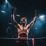 The fighter celebrates the victory in the ring with raised hands