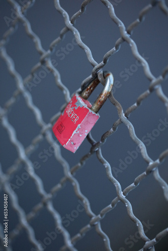 Old and new locks with names and dates written on them couples connection in love lock on a bridge as a sign of love in Dorsten Germany close up high quality instant printings