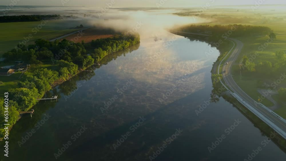 Breathtaking scenic foggy river at dawn, Autumn aerial view.
Breathtaking scenic foggy river at dawn, Autumn aerial view.