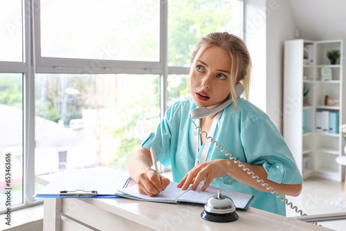 Female medical intern talki...