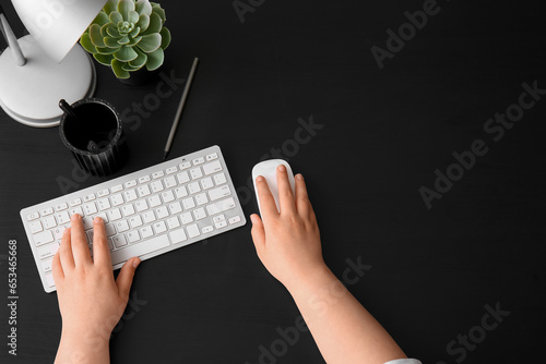 Female programmer using com...