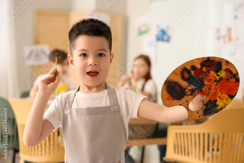 Cute little boy with paint ...
