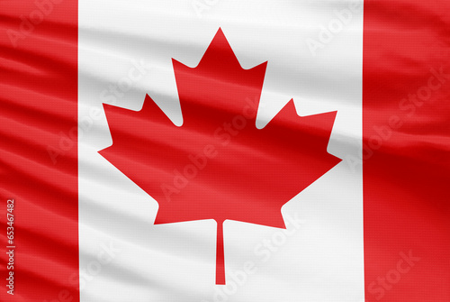 Canada flag is depicted on a sport stitch cloth fabric with folds.