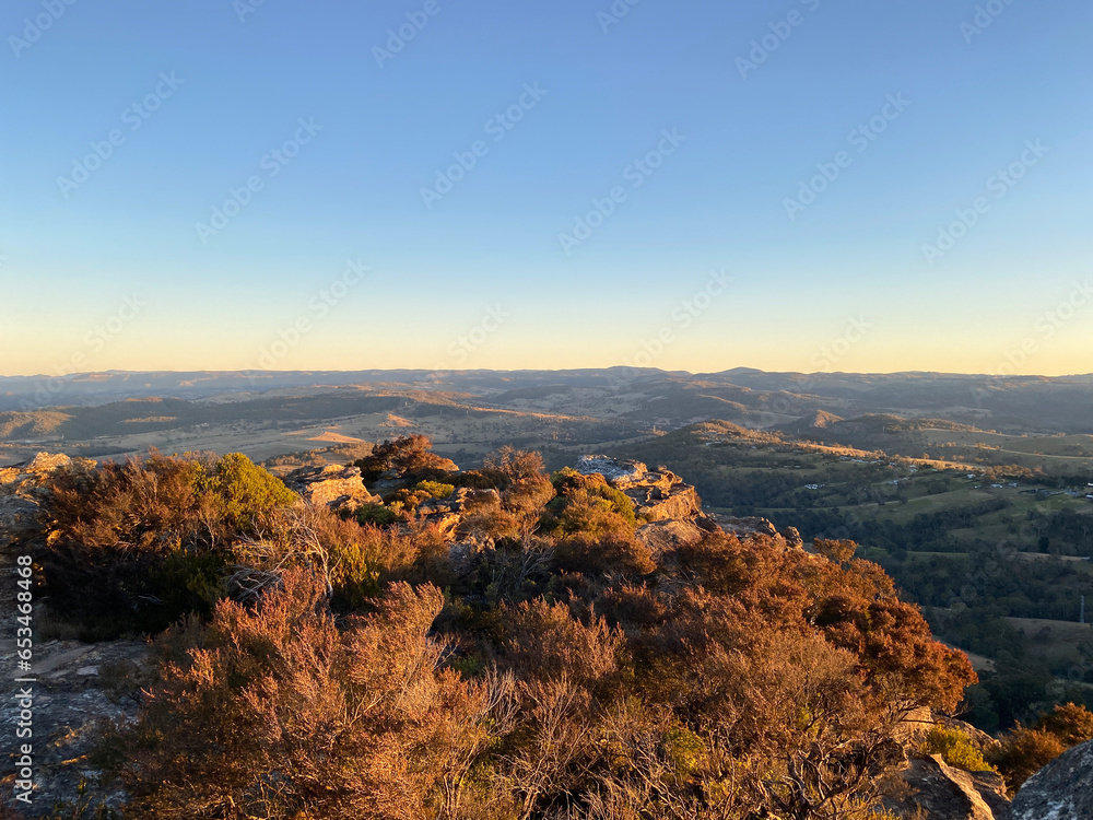 Sunset over the blue mountains, Sydney, Australia, NSW. Spectacular panoramic view from a lookout. Dry bushes.