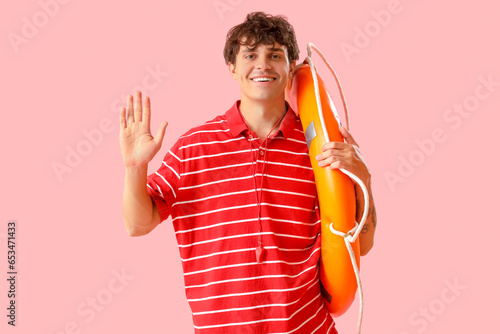 Male lifeguard with ring bu...