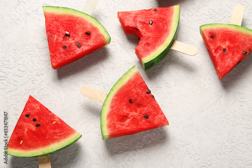 Sweet watermelon sticks on white background