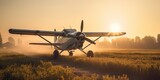 Agricultural aircraft sitting on top of a dirt field / Agricultural field - sun rise  / sunset backlight  