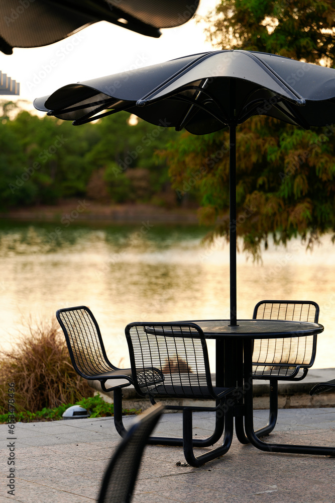 THE WOODLANDS, TEXAS - AUGUST 24th 2023: background settings for outdoor portraits by Lake Woodlands. The lake waters are tranquil, the fall colors are spectacular, there are hidden paths and benches