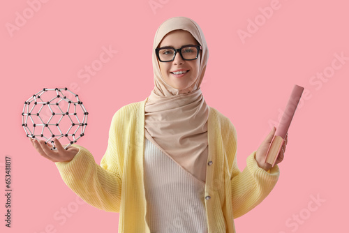 Young Muslim woman with mol...