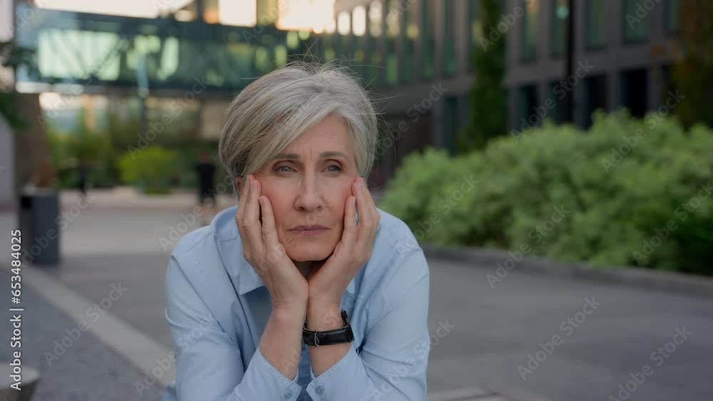 Upset pensive sad worried old woman Caucasian senior businesswoman thinking grief thoughts mature lady contemplate outdoors worry career failure business problem stress tired think solution in city Upset pensive sad worried old woman Caucasian senior businesswoman thinking grief thoughts mature lady contemplate outdoors worry career failure business problem stress tired think solution in city